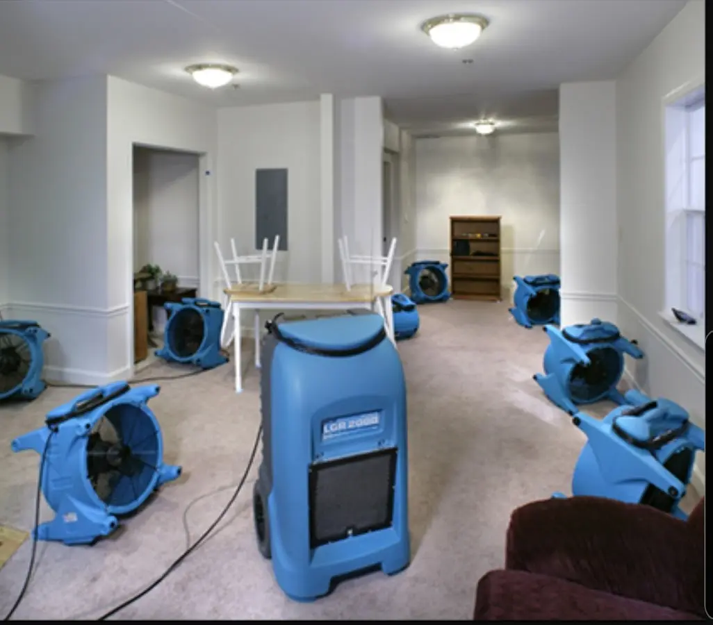 Air movers and dehumidifier setup for Water Damage Restoration in Burnet
